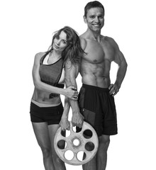 Shirtless middle age sporty male and slim female holds barbell weight.