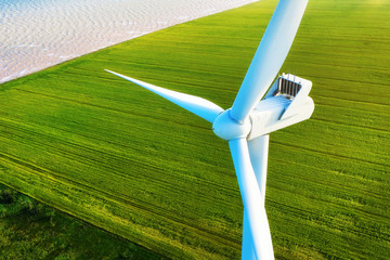 Wind power station on the field. Aerial view from drone. Concept and idea of alternative energy development. Technology - image