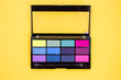 © Anna - Colorful eyeshadow palette on yellow background