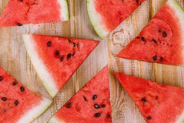 Wall Mural - Pieces of watermelon on a wooden background