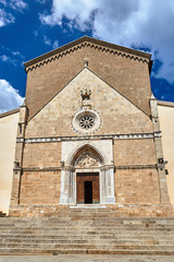 Poster - Facade and portal of a stone, medieval church in the town of Orbetello, Italy.