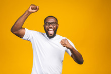Portrait Of Excited Young African American Male Screaming In Shock And Amazement. Surprised Man Looking Impressed, Can't Believe His Own Luck And Success