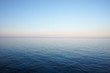 canvas print picture - Seascape in delicate pastel colors with the horizon of the sea and clear sky early in the morning. Mediterranean Sea