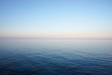 seascape in delicate pastel colors with the horizon of the sea and clear sky early in the morning. m