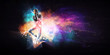 canvas print picture - Modern female dancer jumping in hoodie with colourful splashes background. Mixed media