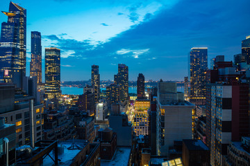 Fototapete - Aerial view of Manhattan skyscrapers lights, New York city, blue sky in the evening