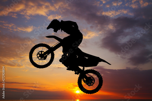 Fotografering  freestyle motocross at sunset