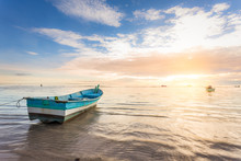 Boat By The Beachside During Beautiful Sunrise