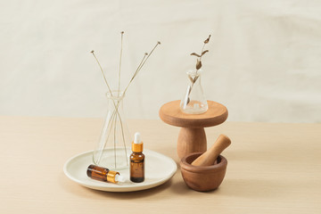Wall Mural - glass flask and test tubes with flowers for medical health or cosmetic science research laboratory