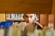© Samuel B. - Black african american young girl student studying at the school university library