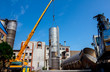 © Roman_23203 - Mobile crane lay down big old metal tank