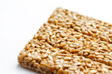 Healthy snacks. Fitness diet food. Kozinaki fritter, seeds, energy bars. White background top view. Isolate, Copy Space