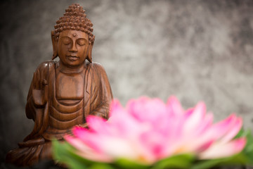 a view of a wood buddha statue