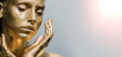 © de Art - Fashion model woman golden skin face in bright sparkles, Trendy glowing gold skin make-up. Glitter metallic shine   makeup