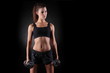 © zhagunov_a - Beautiful fitness woman lifting dumbbells