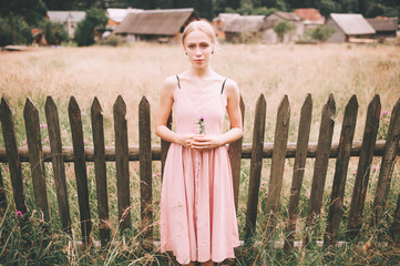 Cute caucasian girl posing for camera. Beautiful woman outdoor portrait.