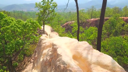 Poster - Impressive landscape of Pai Canyon (Kong Lan) with narrow cliffs of dehydrated yellow clay, rising above the forest level, Thailand