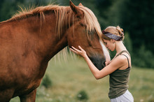 Young Beautiful Girl Hugging Horse At Nature. Horse Lover.