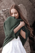 © Iveta - young caucasian woman in warm green knitted cardigan