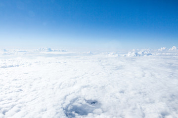 Clouds and sky from airplane window view