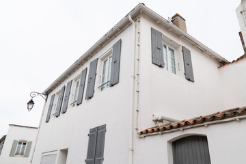 Wall Mural - Isle of Re old white house with grey shutters in France