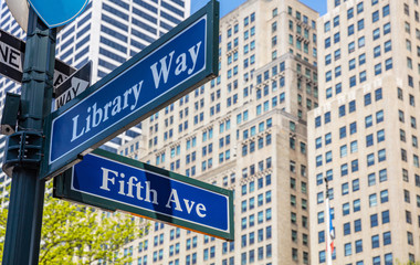 Fototapete - 5th ave and Library Way corner. Blue color street signs, Manhattan New York downtown