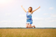 © mikhail_b_azarov - Happy woman jumping and enjoying life in field at sunset