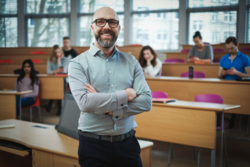lecturer and multinational group of students in an auditorium