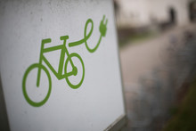 Close Up Shot Of An Electrical Bike Charging Station Sign With S