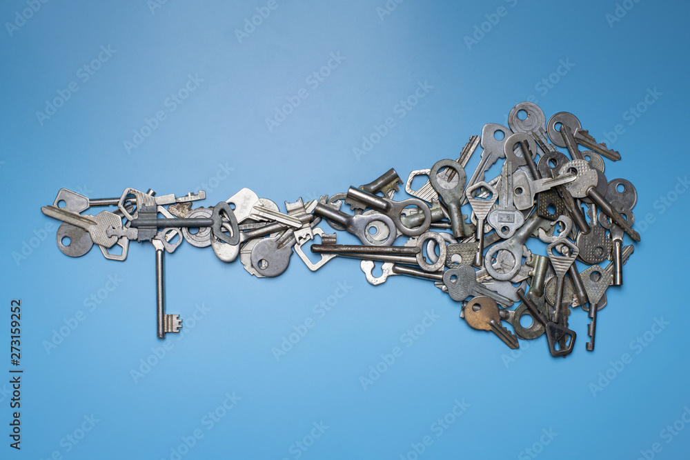 Bunch of keys in shape of big key concept. Different antique and new ...