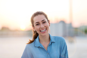 Portrait of a girl on a rooftop enjoying sunset