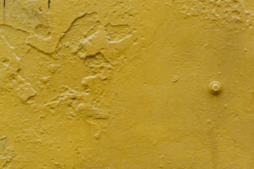  metal surface painted in yellow with texture. background