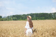 © stock_studio - Beautiful summer girl a wheat field, a white dress, A sunny day. Teenage model summer holidays, vacation and people concept. Rich harvest Concept.  Beauty girl portrait in wheat field at sunset.