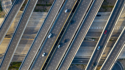 Wall Mural - Aerial top view of highway, Transport city junction road with car on Intersection cross road shot by drone