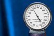 sphygmomanometer closeup, blood pressure measurment medical equipment. Tonometer, medical tool on blue background, close up high resolution.