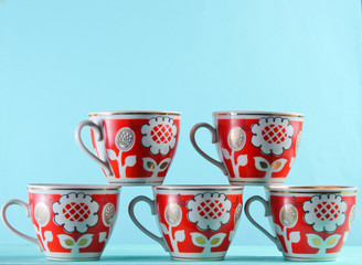 Wall Mural - Five retro cups on a blue background