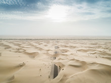 Aerial Abstract View Of Road Covered By Sand In The Desert, Abu Dhabi, UAE.