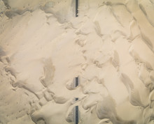Aerial Abstract View Of Road Covered By Sand In The Desert, Abu Dhabi, UAE.