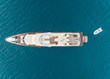 © AmazingAerialAgency - Aerial view of luxurious yacht with small tender in the mediterranean sea, Mikonos island, Greece.