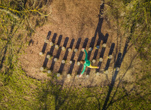 Aerial View Of Man Jumping Over Wooden Stumps, Zagreb, Croatia.