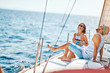 © luckybusiness - Smiling lovers relaxing on a luxury yacht. couple on cruise..