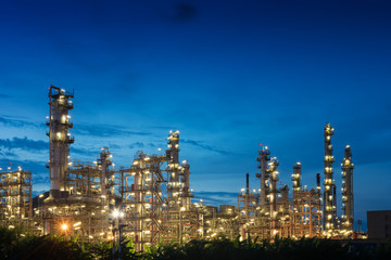 Big industrial oil tanks in a petrochemical plant at sunset