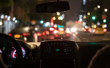 Driving In New York At Night. Interior View Of Taxi Cab In Traffic.