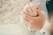 © Pcess609 - Lovers ring.Hand groom couple lovers putting wear the Wedding Ring on bride Holding hands together.