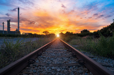 View of the railway track at sunset and industrial concept background