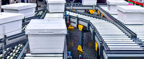 Fotografía White plastic box on conveyor belt