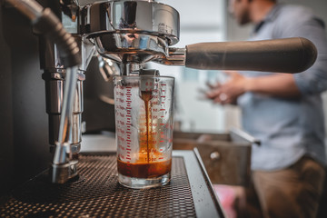 Close-up of espresso pouring from coffee machine