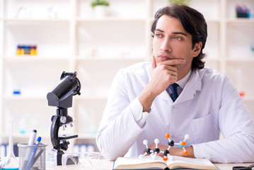 Young male scientist working in the lab 