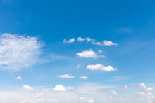 Deep Blue Sunny Sky With White Clouds. Blue Sky With Cloud Closeup. White Fluffy Clouds In The Blue Sky.