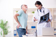 © Elnur - Old man visiting young male doctor